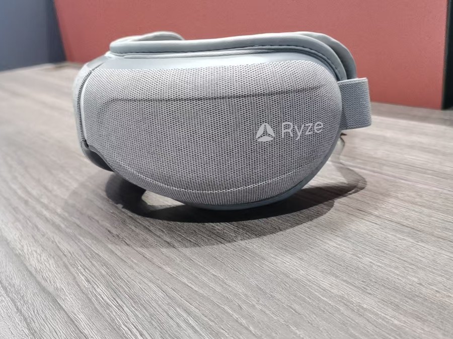 Kaisum eye massager built for Ryze, grey cloth wrap with the Ryze mark on the fabric
